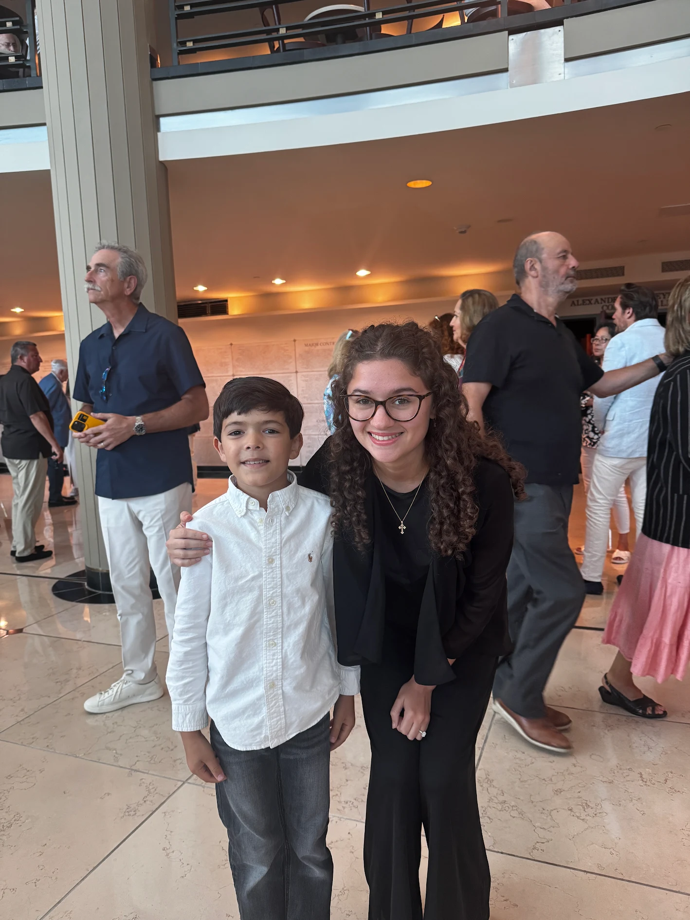 Victoria with a young student at a concert hall performance